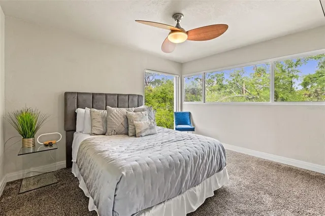 a bedroom with a bed and window