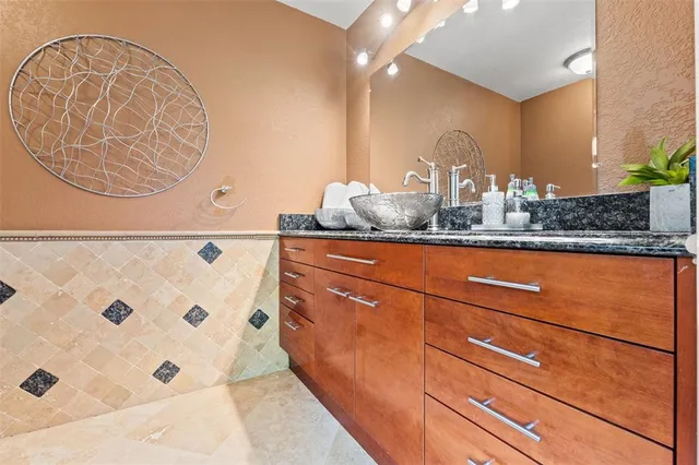 a backyard of a house with table and chairs