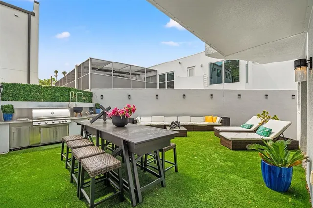 a view of a dinning table and chairs in the patio
