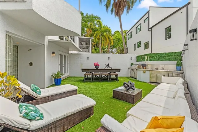 a view of a hallway with chairs and couches in a room