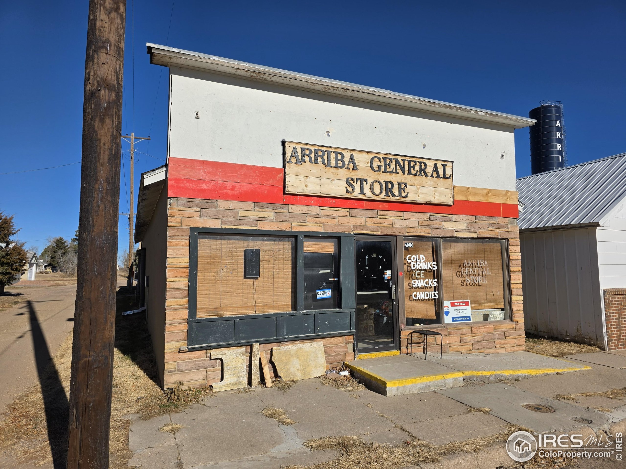 a view of a shop in a street