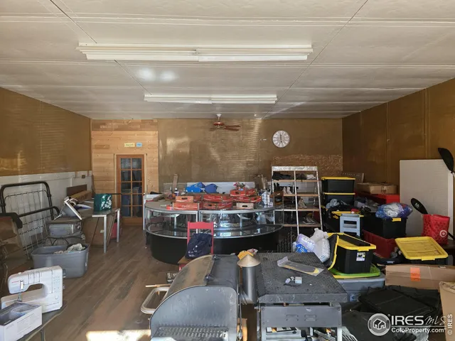 a room with lots of furniture and clutter