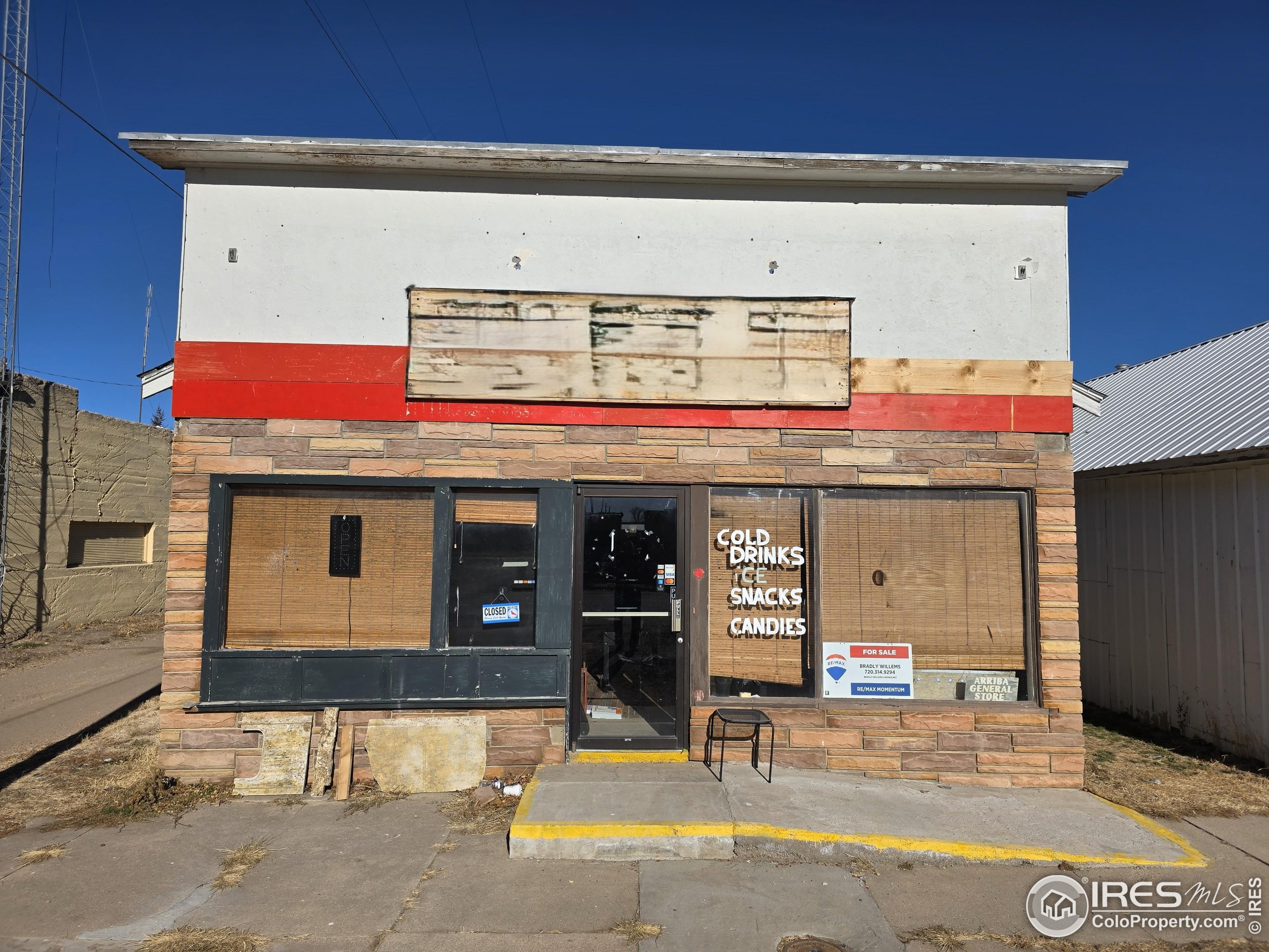 713 Front Street Arriba, CO 80804 - Photo 3 of 4 a view of a building with car parked