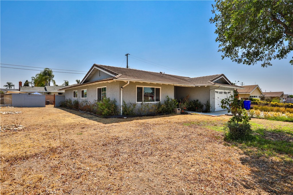 9363 Exeter Avenue Montclair, CA 91763 - Photo 1 of 1 a front view of a house with a yard
