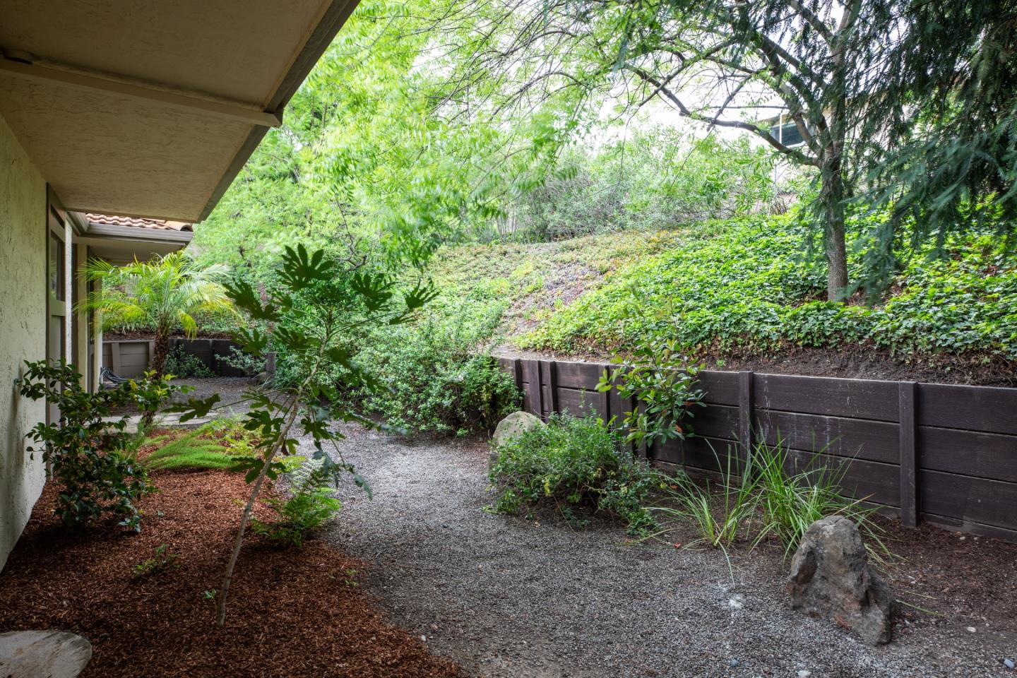 22415 Rancho Deep Cliff Drive Cupertino, CA 95014 - Photo 28 of 33 a backyard of a house with lots of green space