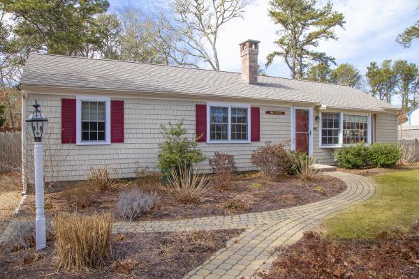 58 Aunt Debbys Road Dennis Port, MA 02639 - Photo 1 of 38 a front view of a house with garden