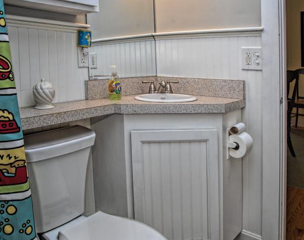 58 Aunt Debbys Road Dennis Port, MA 02639 - Photo 29 of 38 a bathroom with a granite countertop toilet sink and mirror