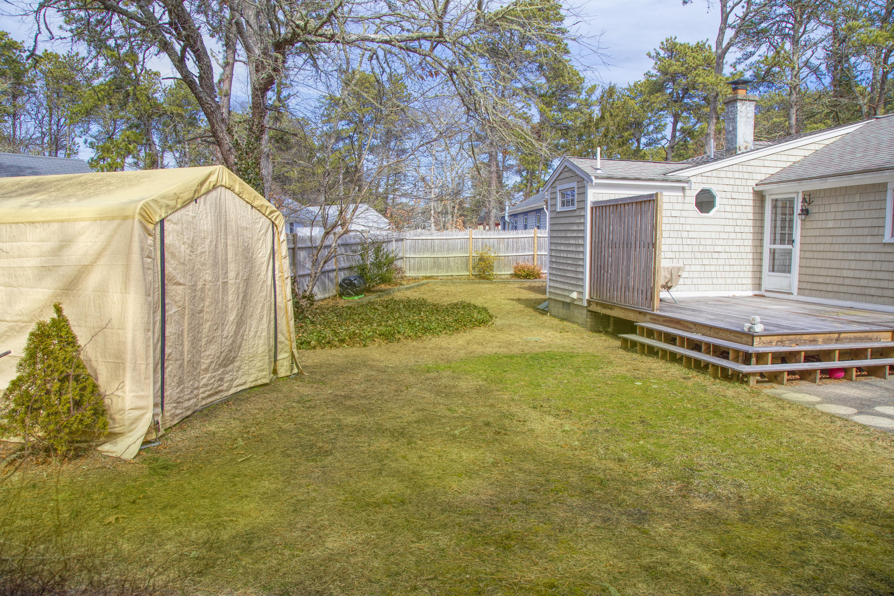 58 Aunt Debbys Road Dennis Port, MA 02639 - Photo 9 of 38 a view of a house with backyard and trees