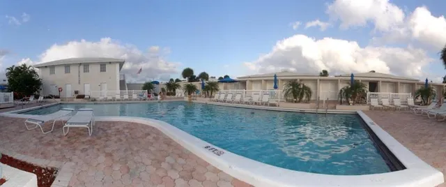 a view of a swimming pool with a sitting area