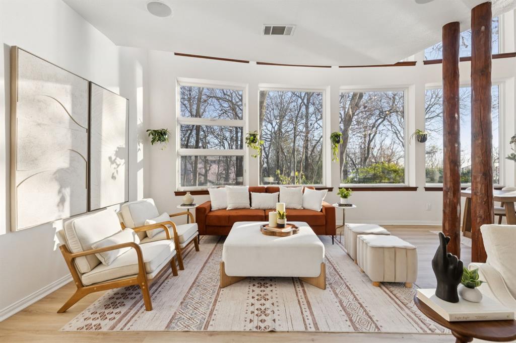 540 Diamond Point Drive Oak Point, TX 75068 - Photo 12 of 27 Living area with healthy amount of natural light and wood finished floors