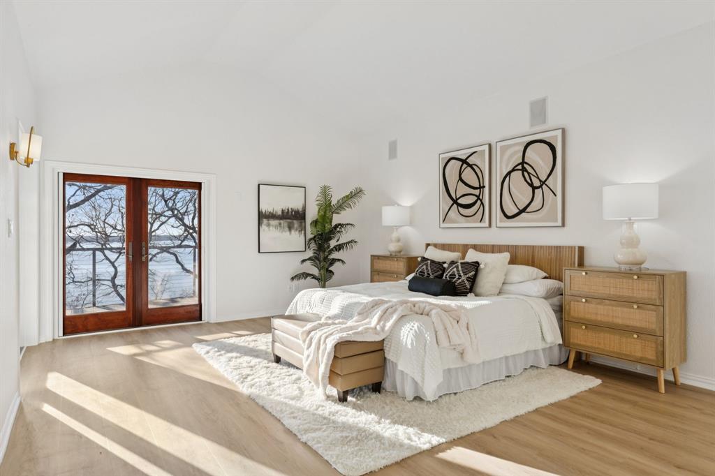 540 Diamond Point Drive Oak Point, TX 75068 - Photo 15 of 27 Bedroom with french doors, vaulted ceiling, and wood finished floors