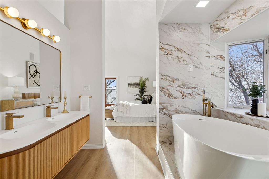 540 Diamond Point Drive Oak Point, TX 75068 - Photo 17 of 27 Full bathroom featuring ensuite bathroom, a freestanding tub, double vanity, and plenty of natural light
