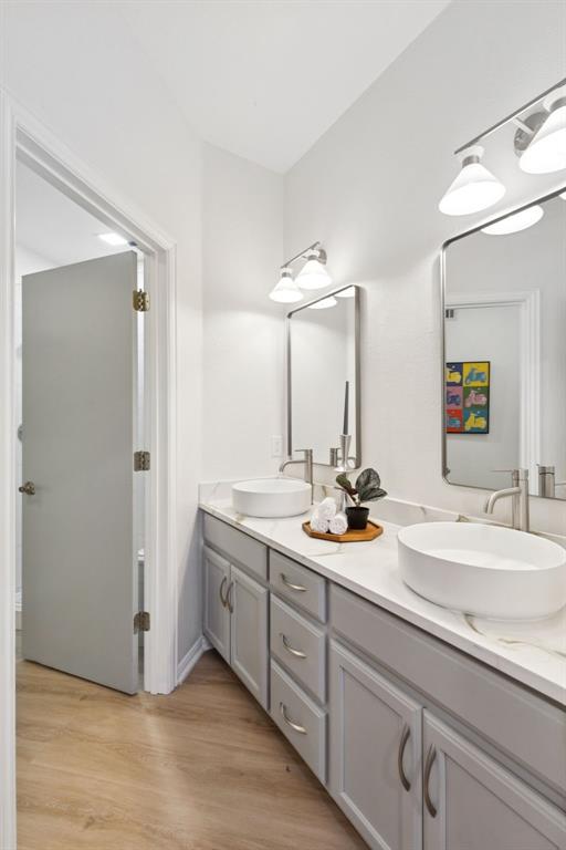 540 Diamond Point Drive Oak Point, TX 75068 - Photo 22 of 27 Bathroom featuring double vanity and light wood-style floors
