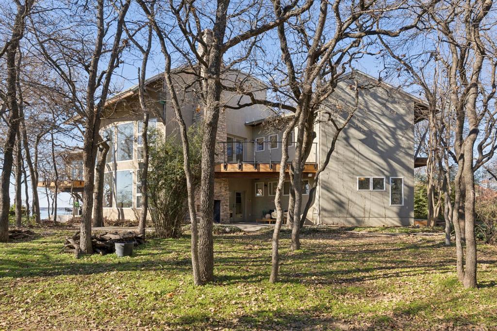 540 Diamond Point Drive Oak Point, TX 75068 - Photo 6 of 27 Side view of property featuring a patio area, a yard, and a balcony