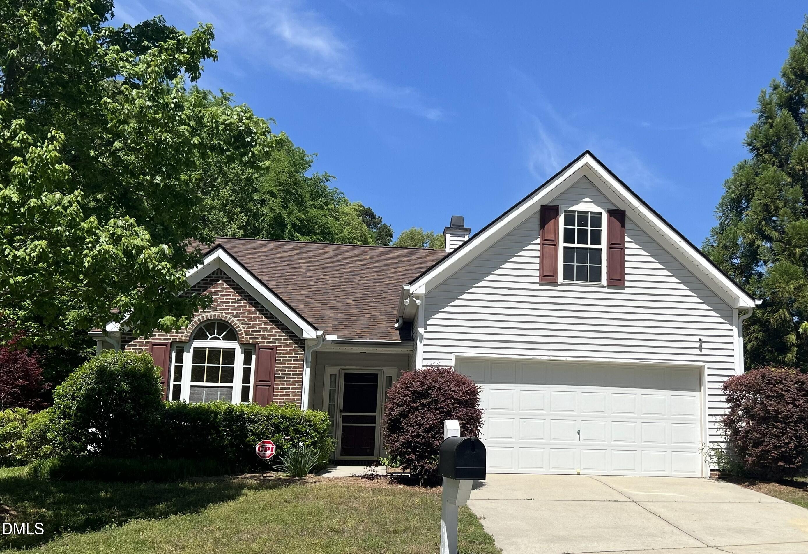 a view of house with a yard