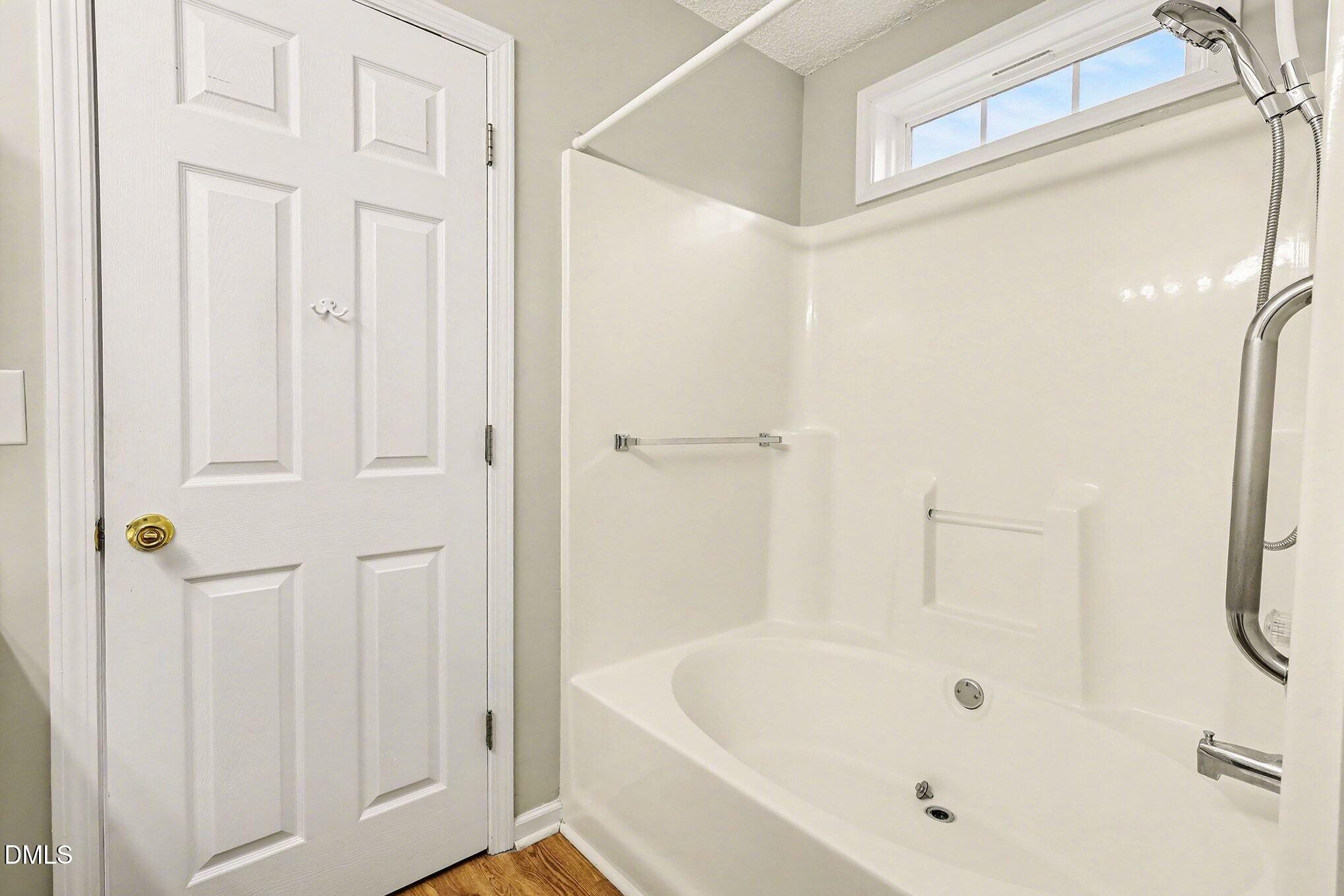 5017 Tapestry Terrace Durham, NC 27713 - Photo 17 of 28 a bathroom with a bathtub