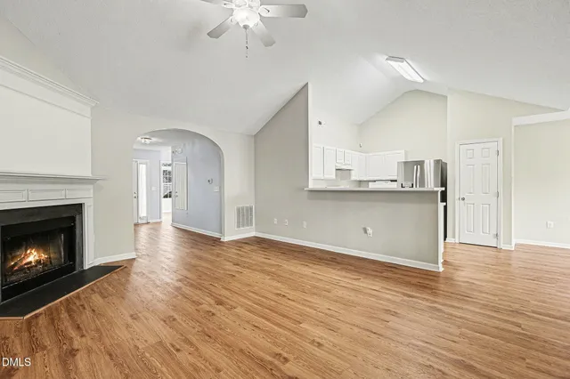 a view of a kitchen with furniture and a fireplace