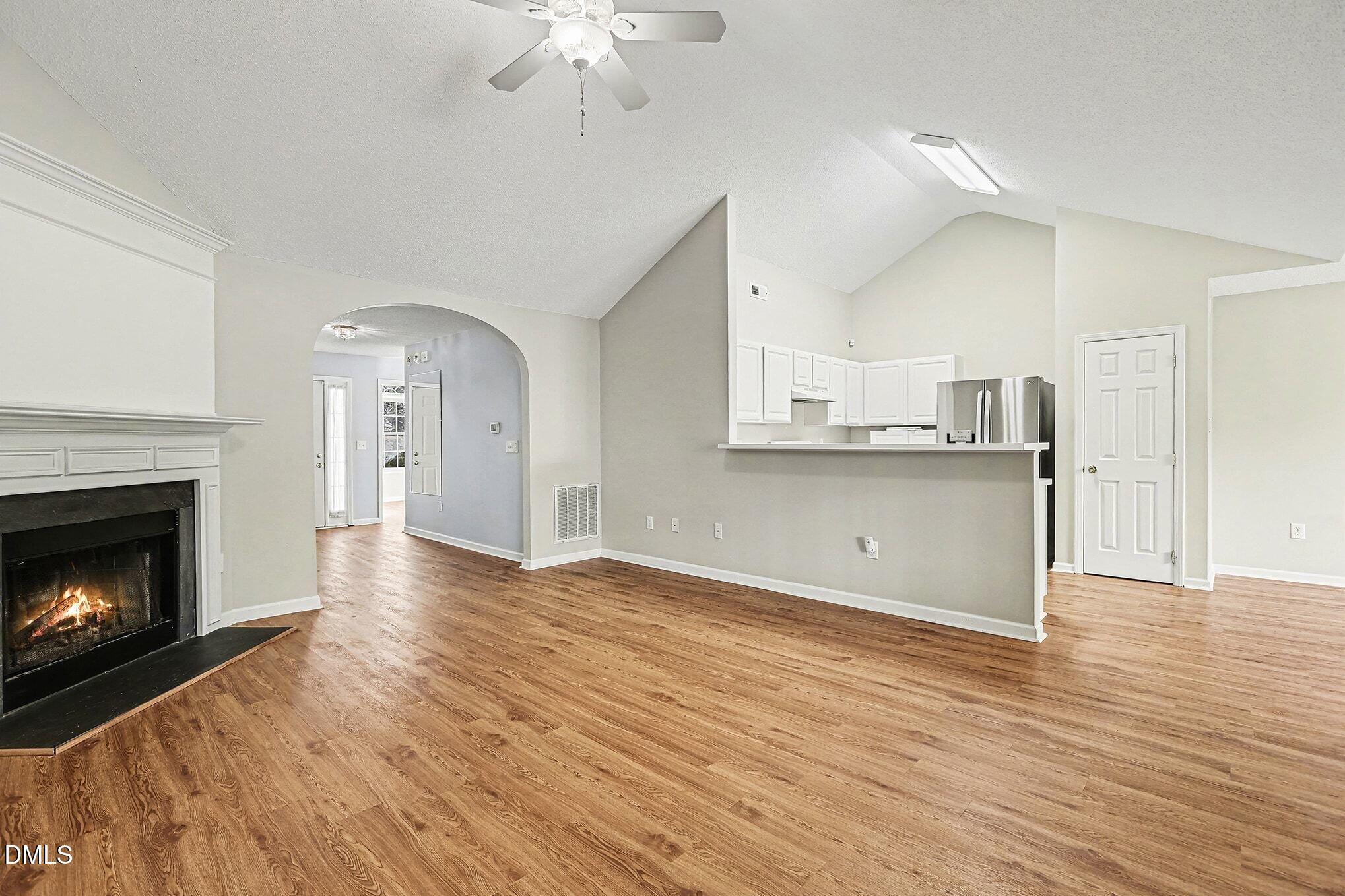 5017 Tapestry Terrace Durham, NC 27713 - Photo 5 of 28 a view of a kitchen with furniture and a fireplace