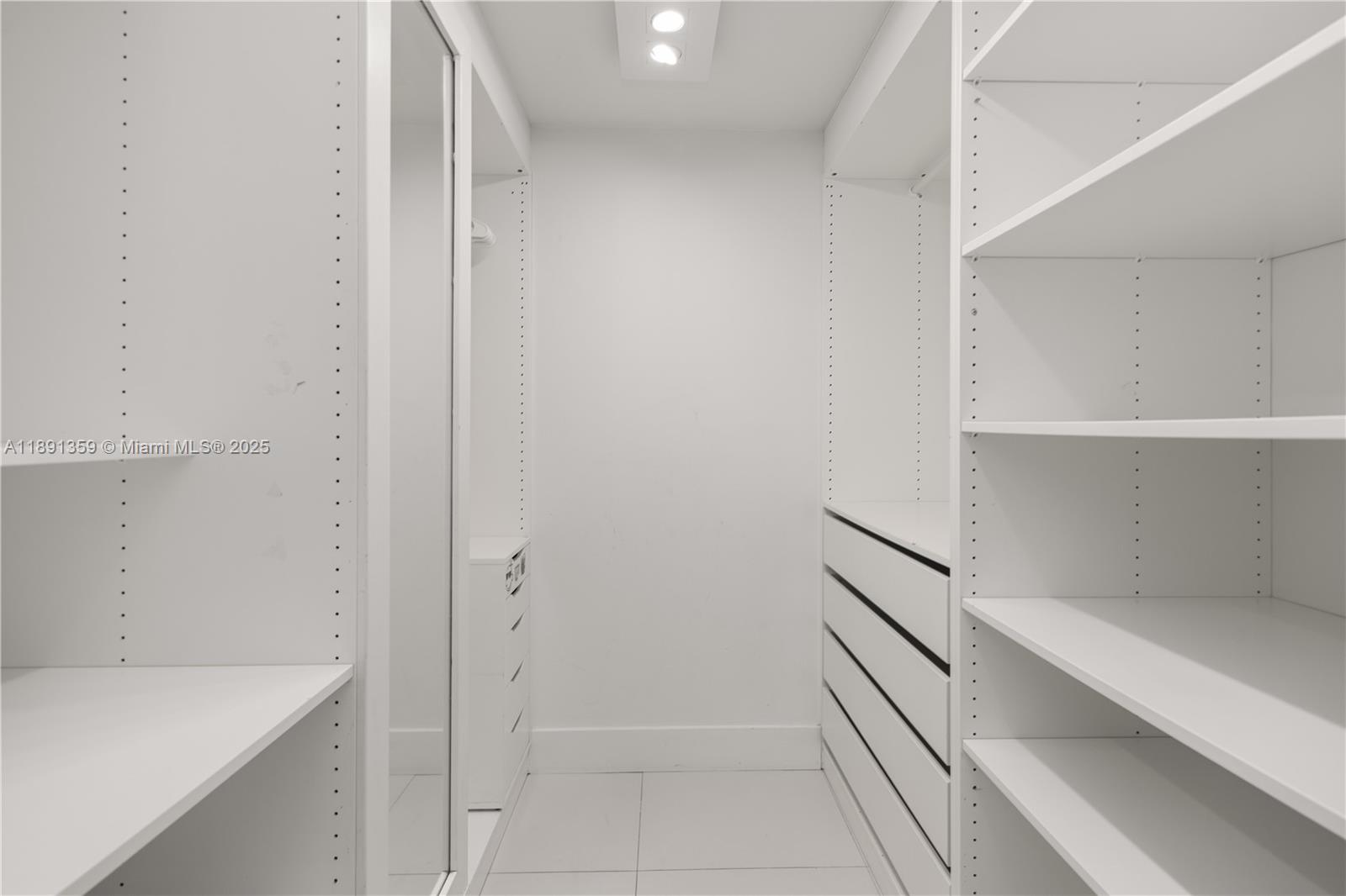 101 Crandon Boulevard, Unit 379 Key Biscayne, FL 33149 - Photo 13 of 37 a view of an empty walk in closet