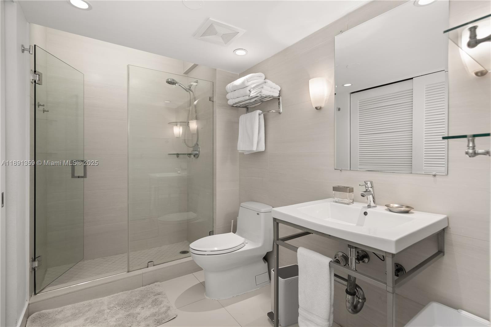 101 Crandon Boulevard, Unit 379 Key Biscayne, FL 33149 - Photo 14 of 37 a bathroom with a sink toilet and shower