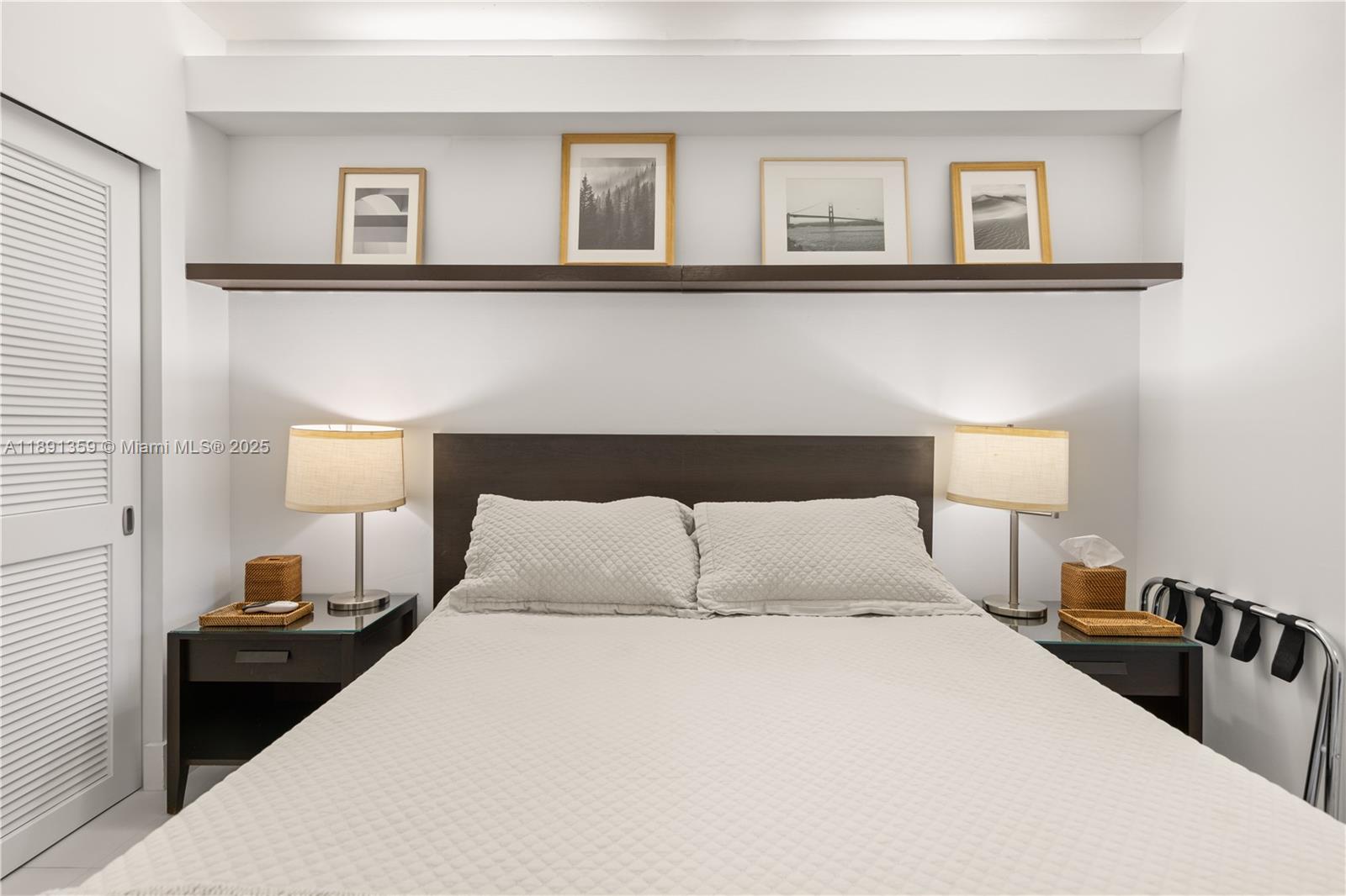 101 Crandon Boulevard, Unit 379 Key Biscayne, FL 33149 - Photo 17 of 37 a bedroom with a bed and a night stand