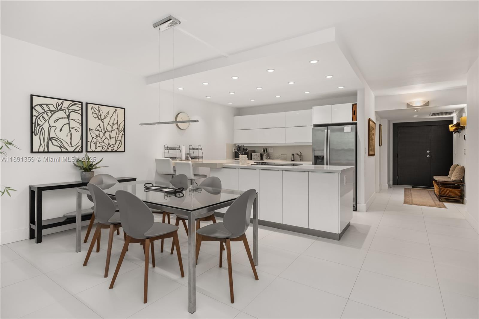 101 Crandon Boulevard, Unit 379 Key Biscayne, FL 33149 - Photo 19 of 37 a view of a dining room with furniture