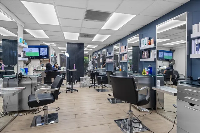 a living room with lots of furniture and clutter