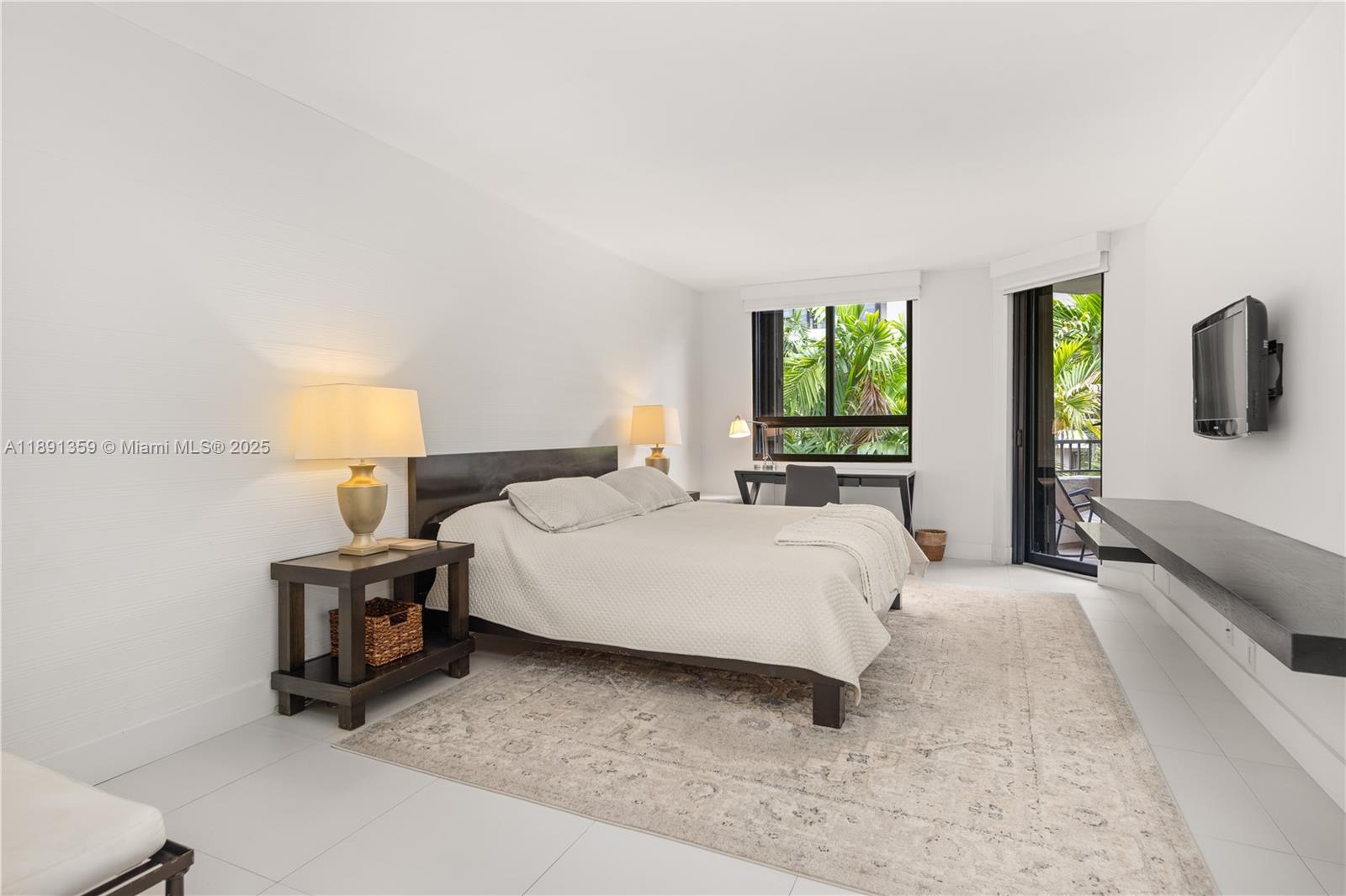 101 Crandon Boulevard, Unit 379 Key Biscayne, FL 33149 - Photo 5 of 37 a bedroom with a bed and window