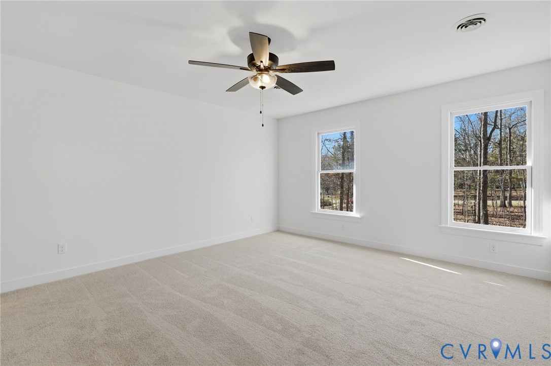 3264 Sherwood Ridge Way Powhatan, VA 23139 - Photo 19 of 40 a view of room with window and ceiling fan