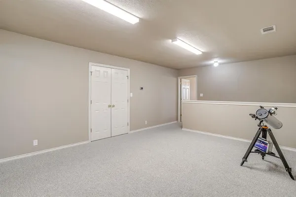 a view of room with gym equipment