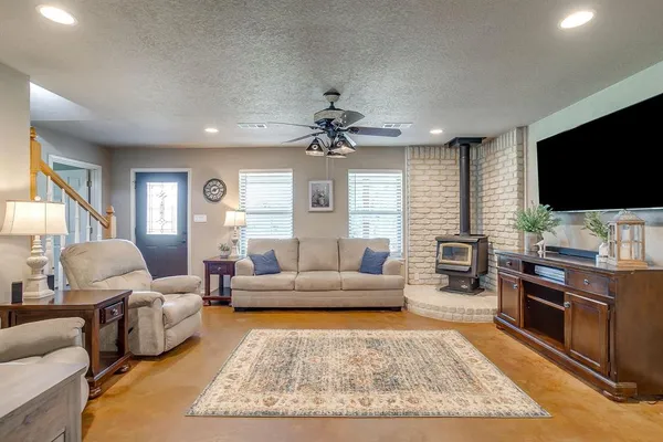 a living room with furniture and a flat screen tv