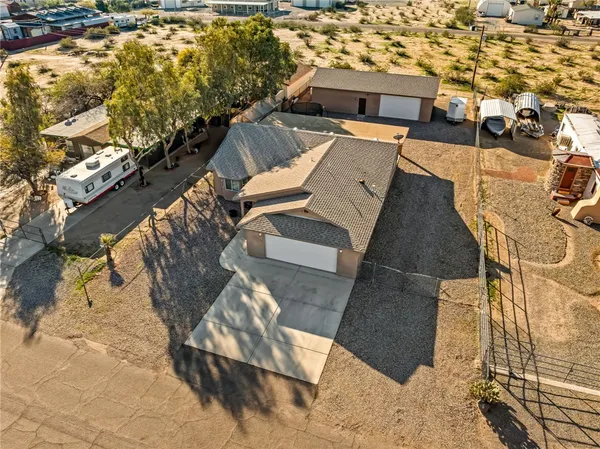 an aerial view of a house with a yard