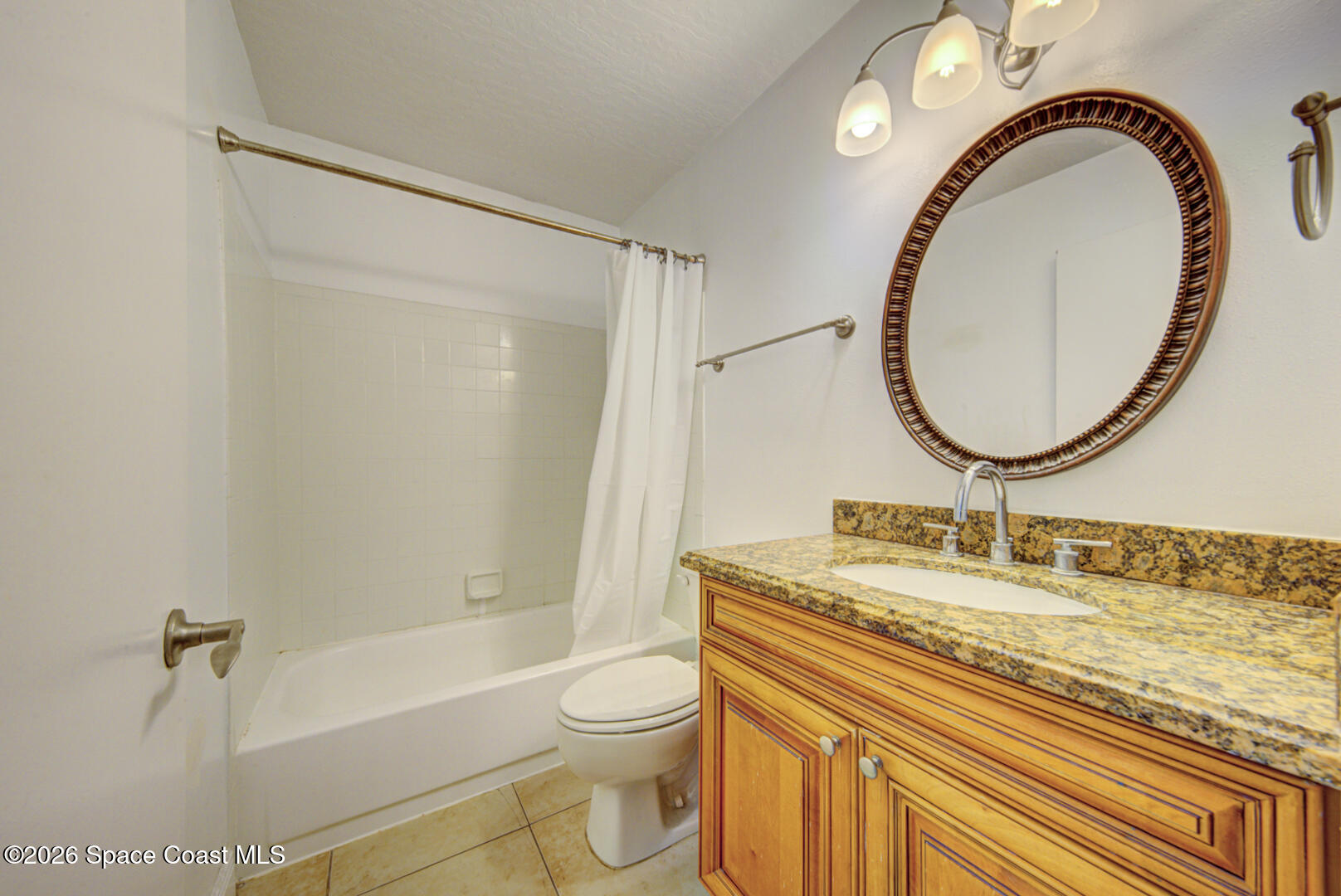 7667 North Wickham Road, Unit 1416 Melbourne, FL 32940 - Photo 21 of 41 a bathroom with a sink and a mirror