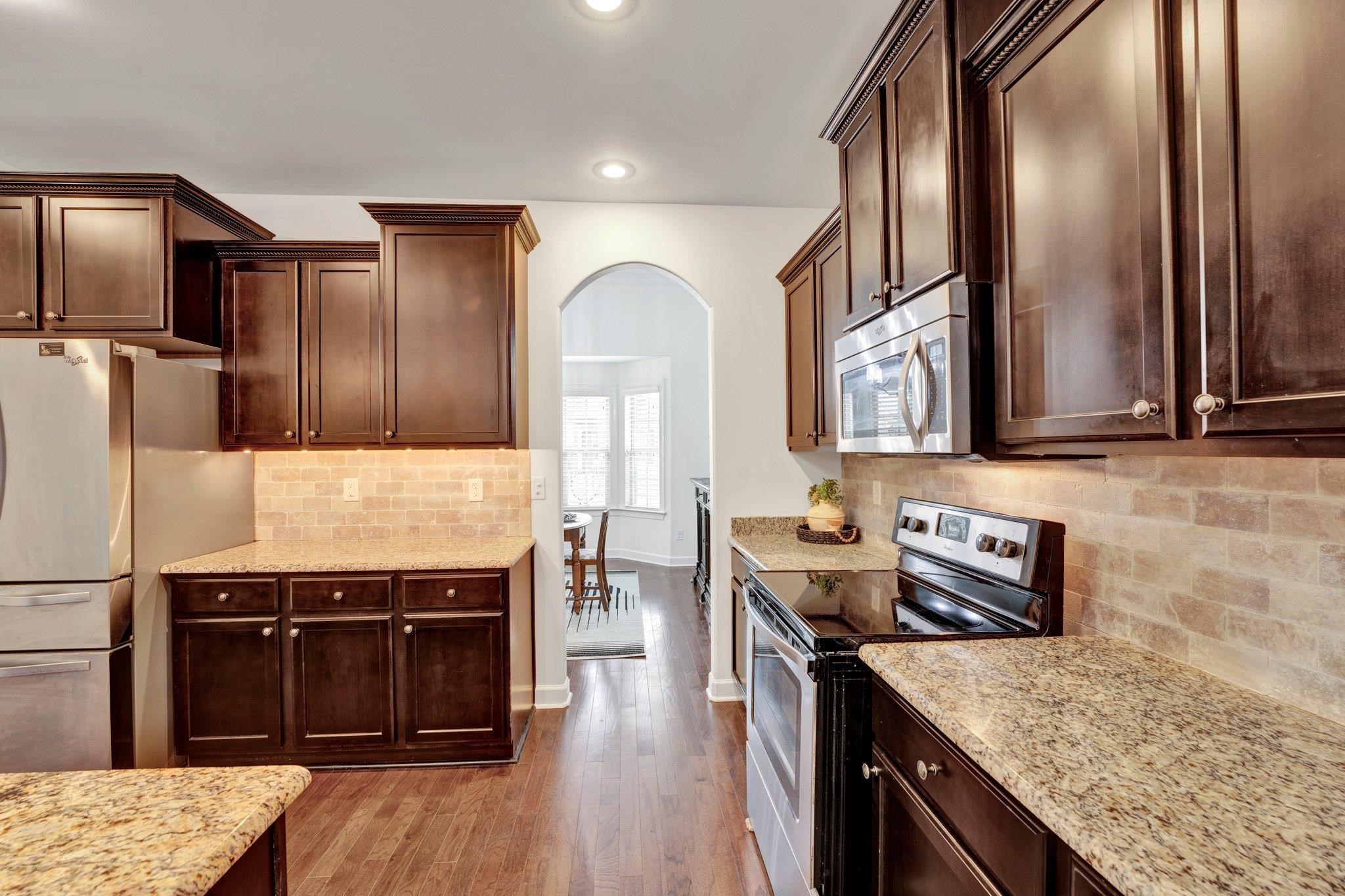 1965 Rochelle Lane Cordova, TN 38016 - Photo 12 of 40 a kitchen with stainless steel appliances granite countertop a stove and a sink