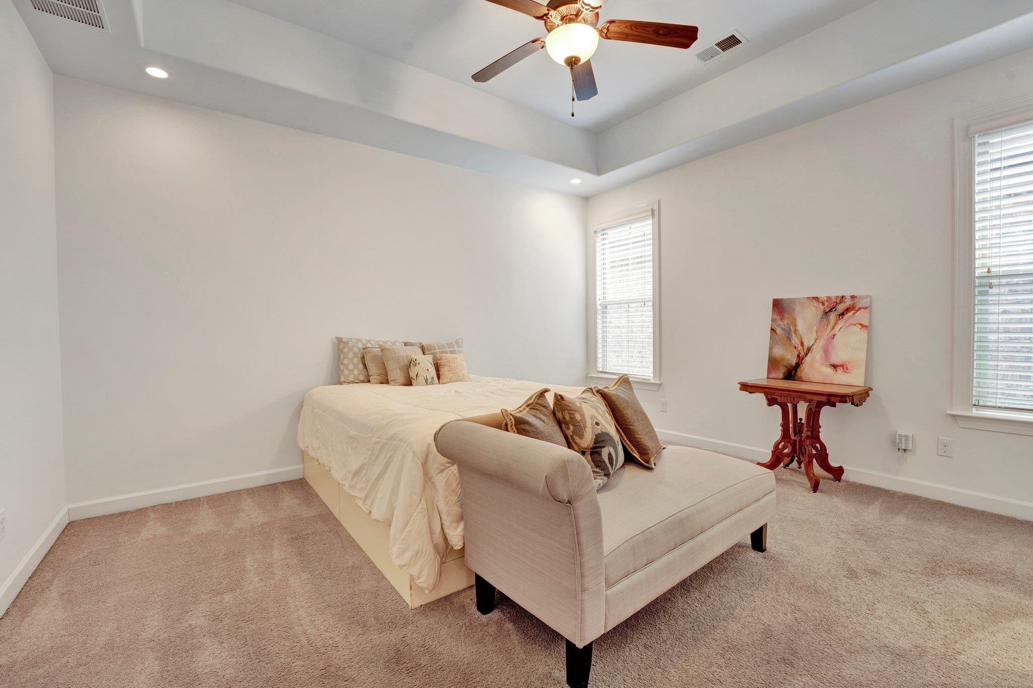1965 Rochelle Lane Cordova, TN 38016 - Photo 24 of 40 a bedroom with a bed and a chandelier