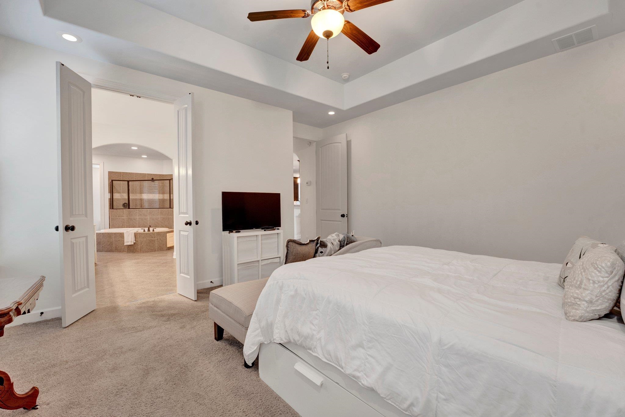 1965 Rochelle Lane Cordova, TN 38016 - Photo 25 of 40 a bedroom with a bed and a flat screen tv