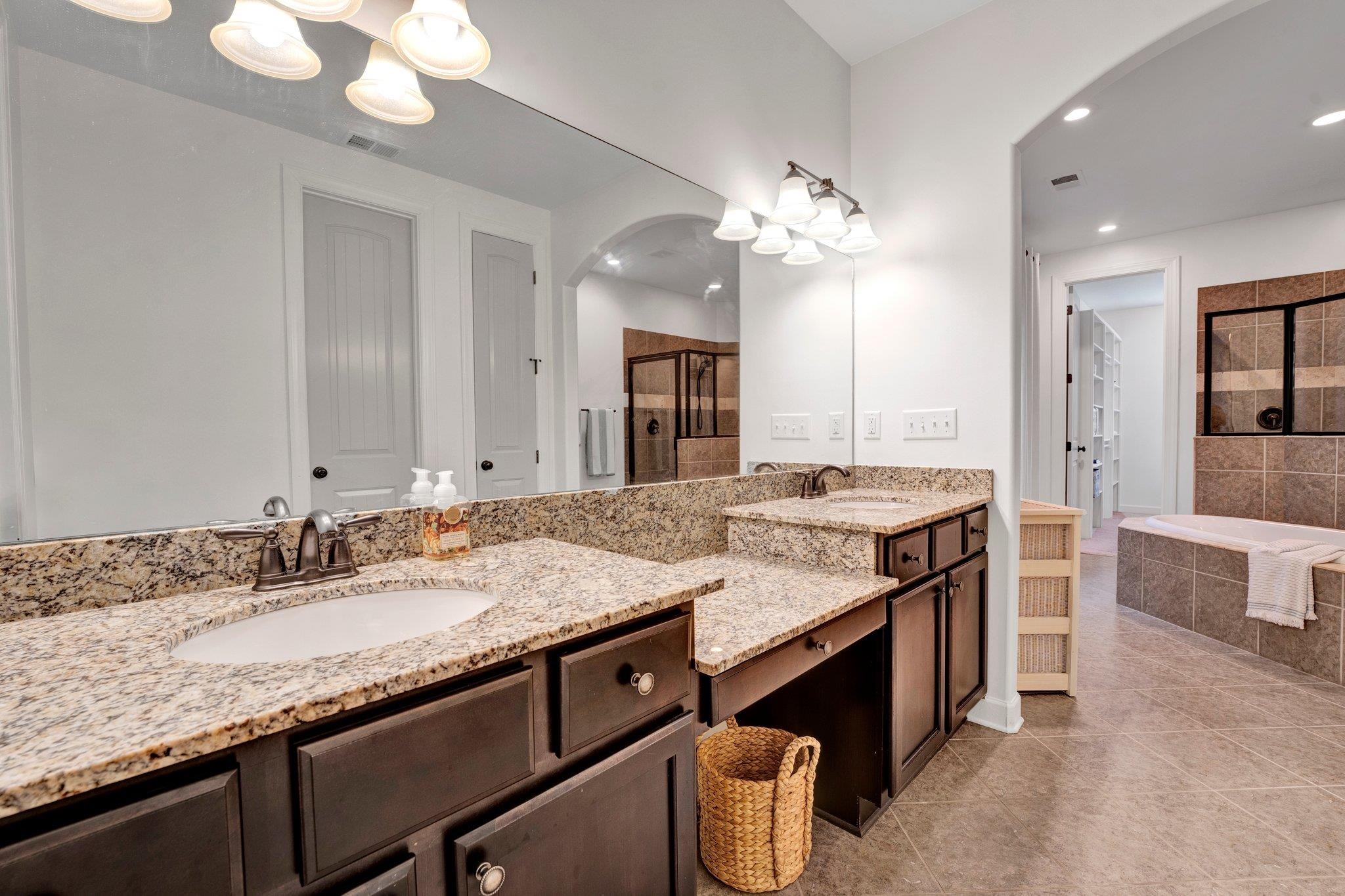 1965 Rochelle Lane Cordova, TN 38016 - Photo 27 of 40 a bathroom with a granite countertop double vanity sink and a mirror