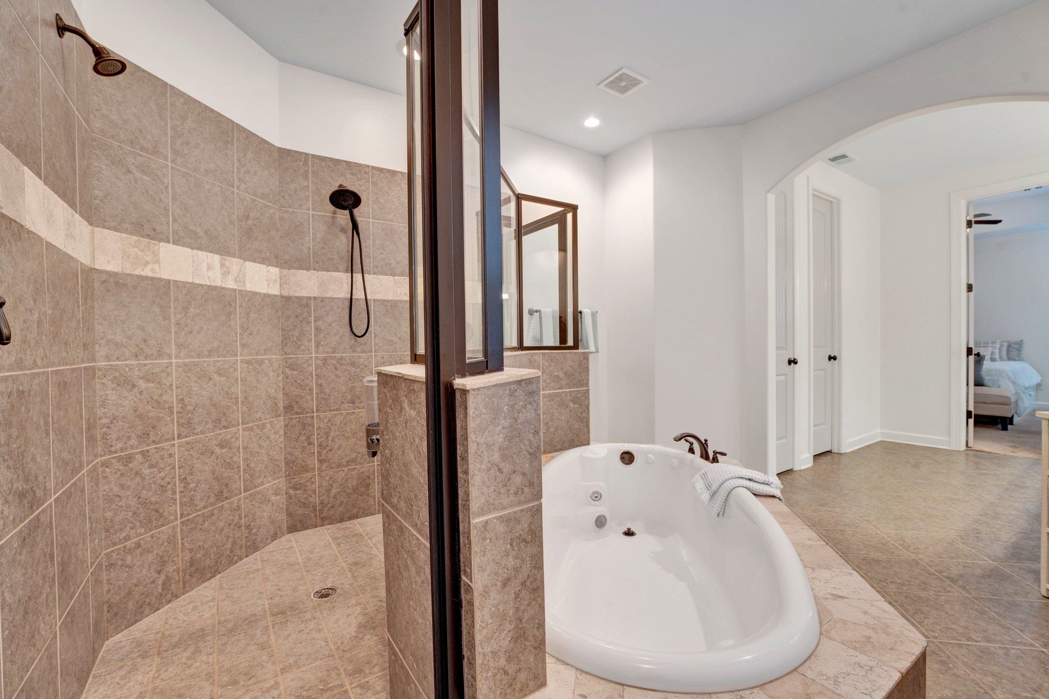 1965 Rochelle Lane Cordova, TN 38016 - Photo 30 of 40 a bathroom with a bathtub and a shower