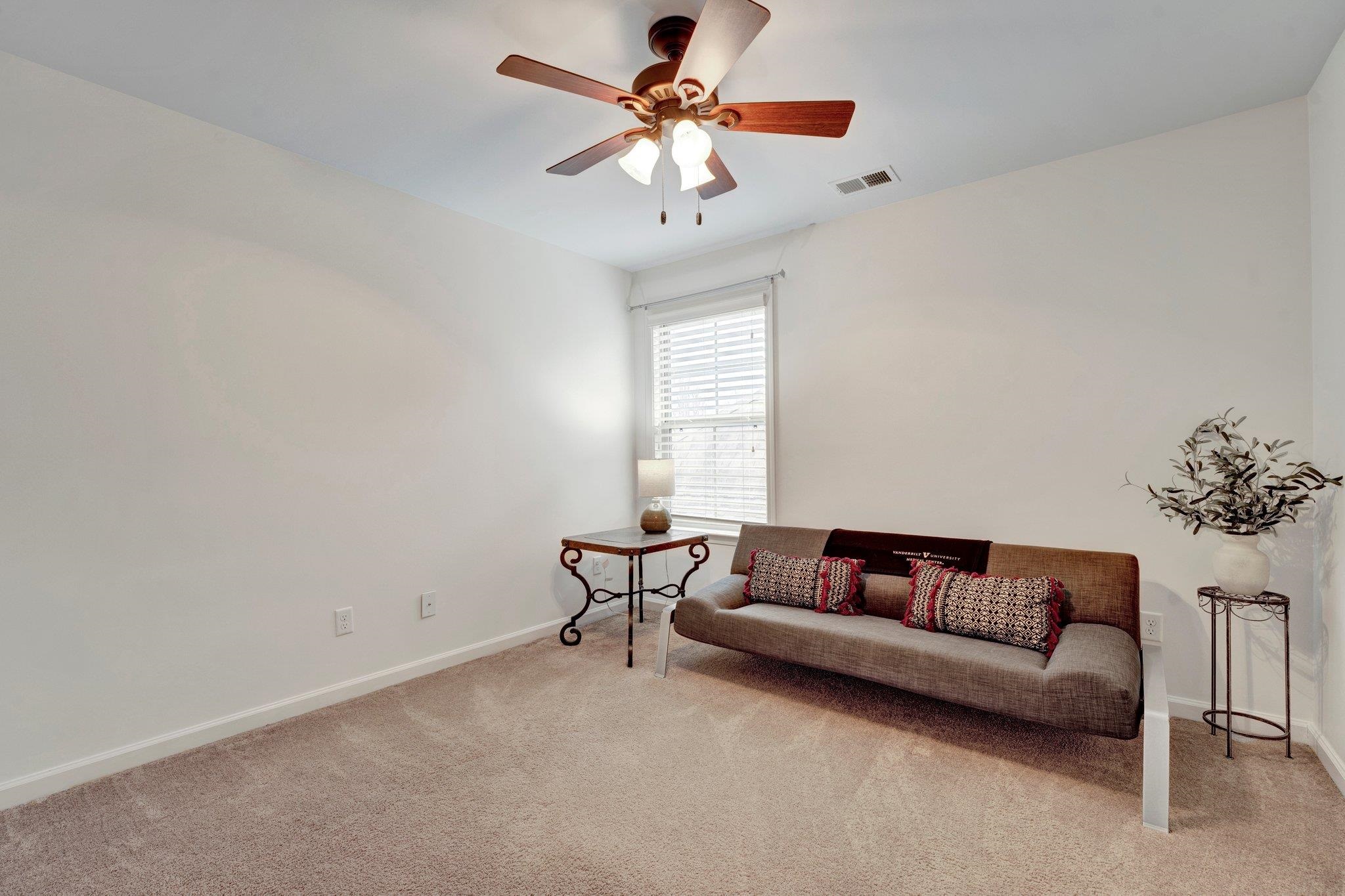 1965 Rochelle Lane Cordova, TN 38016 - Photo 33 of 40 a living room with furniture and a chandelier