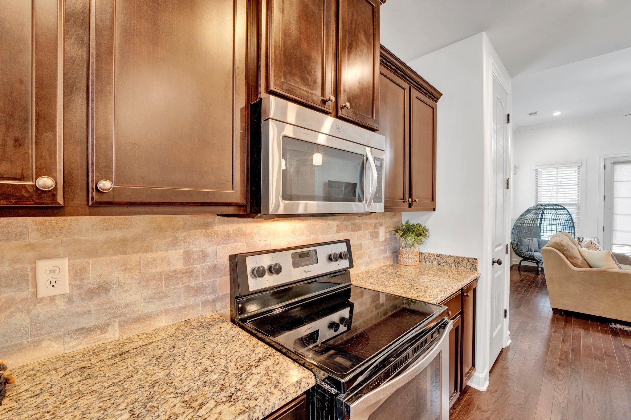 1965 Rochelle Lane Cordova, TN 38016 - Photo 5 of 40 a kitchen with granite countertop cabinets stainless steel appliances and a counter space