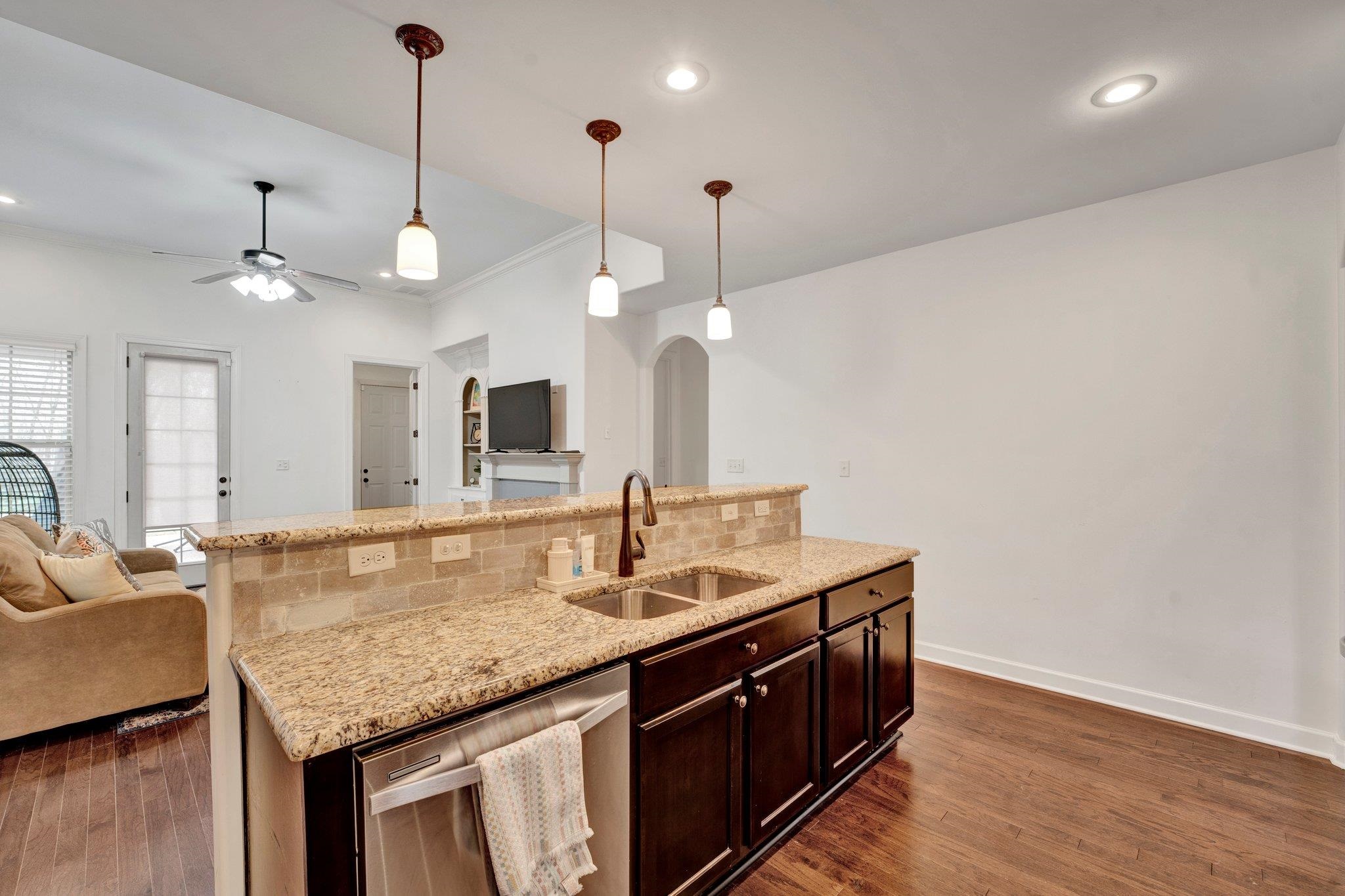 1965 Rochelle Lane Cordova, TN 38016 - Photo 6 of 40 a kitchen with granite countertop kitchen island a sink and a wooden floor