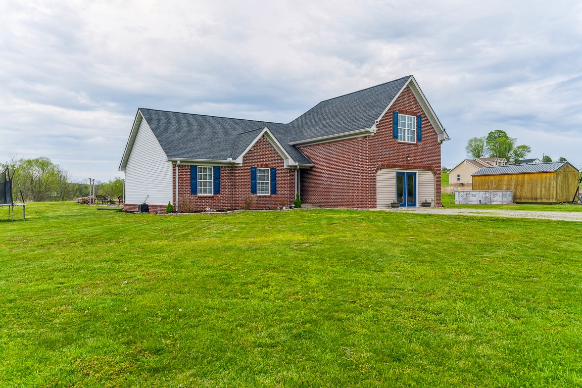 497 Puckett Road Watertown, TN 37184 - Photo 1 of 27 a front view of house with garden