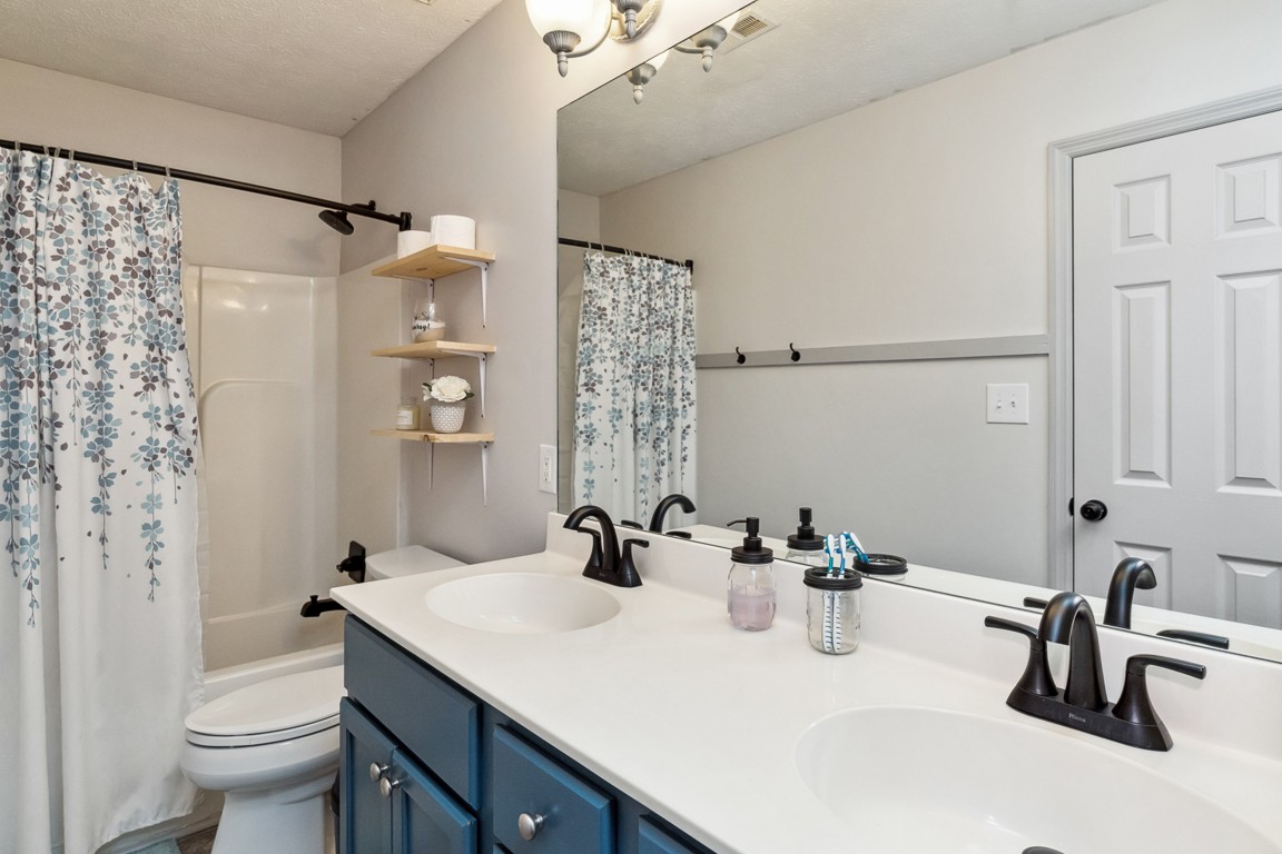 497 Puckett Road Watertown, TN 37184 - Photo 14 of 27 a bathroom with a sink and a mirror