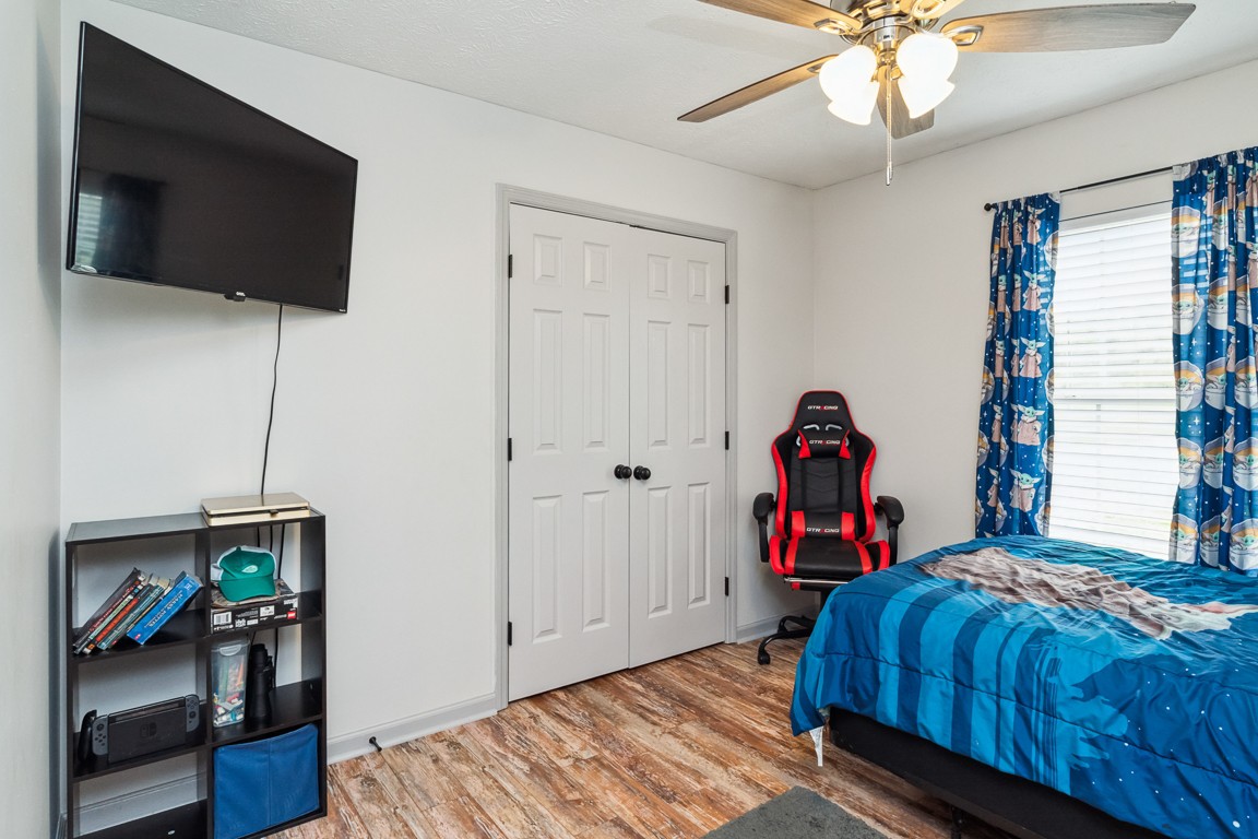 497 Puckett Road Watertown, TN 37184 - Photo 17 of 27 a bed room with a bed and a flat screen tv