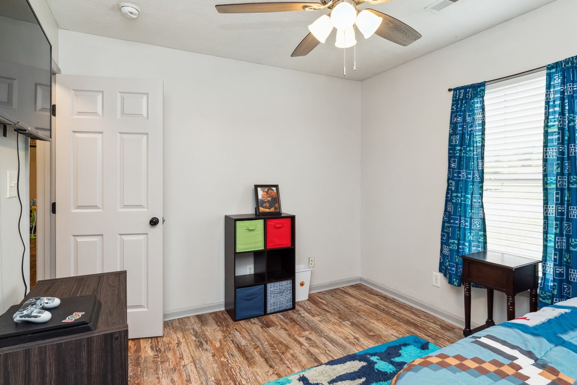 497 Puckett Road Watertown, TN 37184 - Photo 20 of 27 a bedroom with a bed and a bookshelf