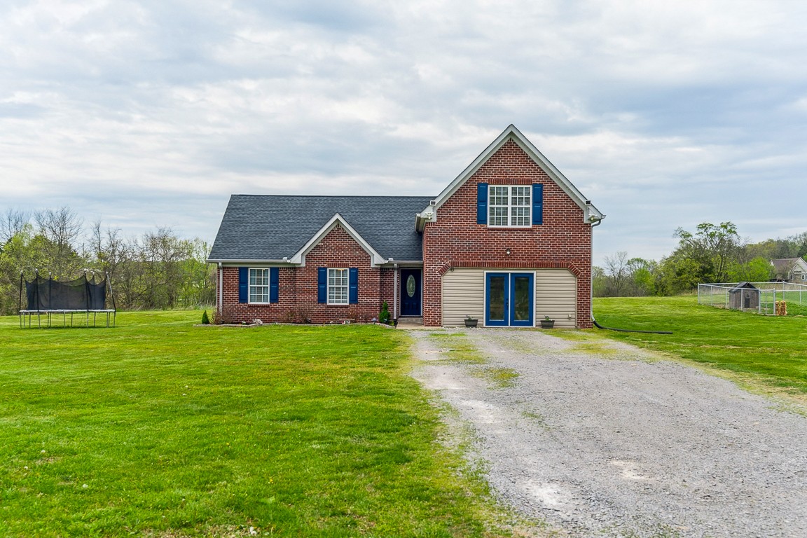 497 Puckett Road Watertown, TN 37184 - Photo 2 of 27 a front view of a house with garden