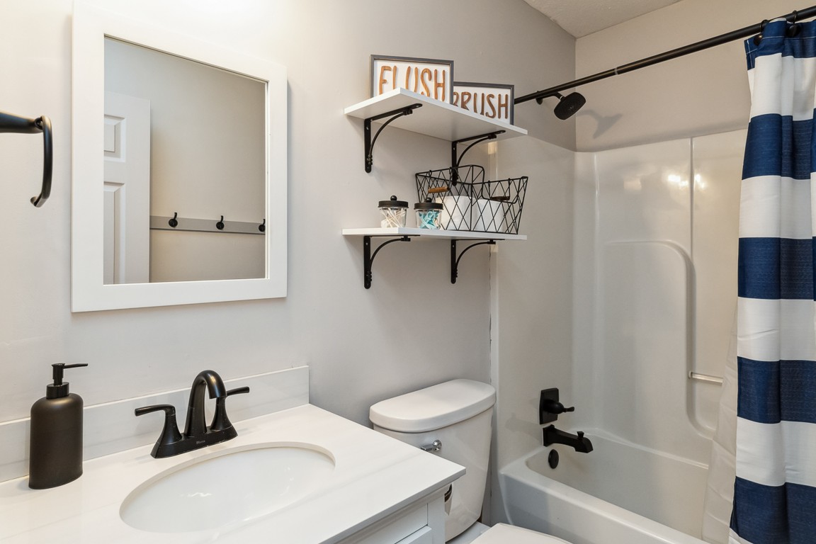 497 Puckett Road Watertown, TN 37184 - Photo 21 of 27 a bathroom with a sink a toilet and shower