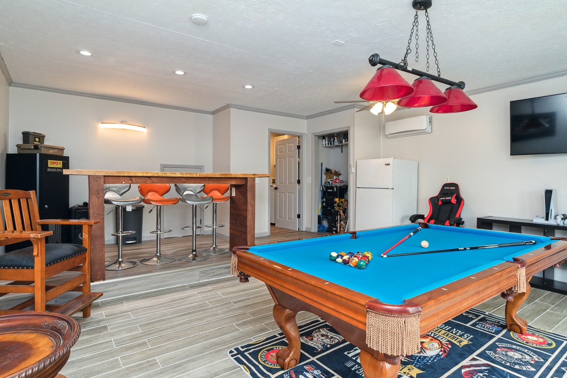 497 Puckett Road Watertown, TN 37184 - Photo 23 of 27 a room with pool table flat screen tv and couches