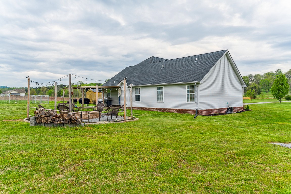 497 Puckett Road Watertown, TN 37184 - Photo 25 of 27 a view of a house with backyard and porch
