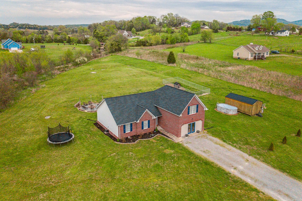 497 Puckett Road Watertown, TN 37184 - Photo 3 of 27 an aerial view of a house with outdoor space swimming pool and mountains